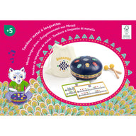 Metal tongue drum set with carrying bag and instruction cards on a colorful background